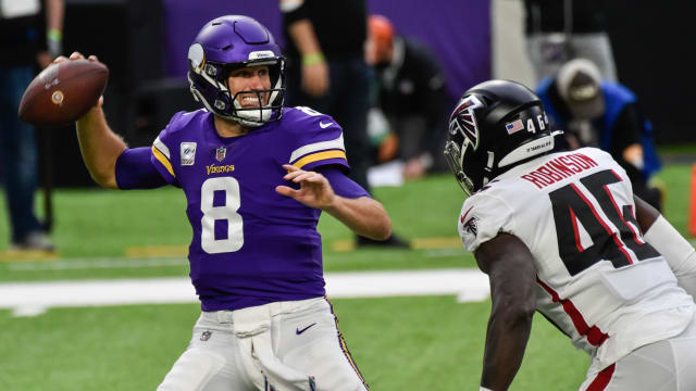 Oct 18, 2020; Minneapolis, Minnesota, USA; Minnesota Vikings quarterback Kirk Cousins (8) prepares to throw a pass as Atlanta Falcons linebacker Edmond Robinson (46) rushes during the first quarter at U.S. Bank Stadium.